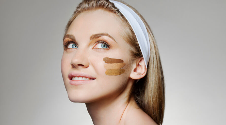 woman with three samples of bb cream on her face