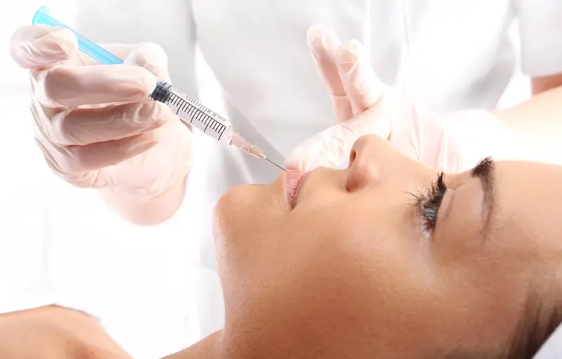 woman receiving a filler injection