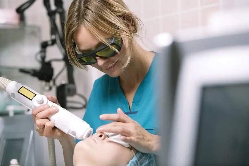 woman receiving laser treatment